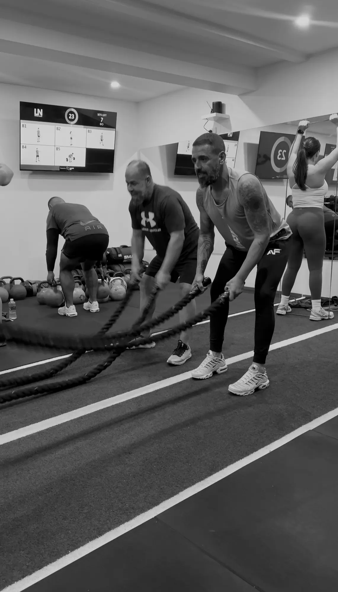 LNPT members work with battle ropes during a group training session.