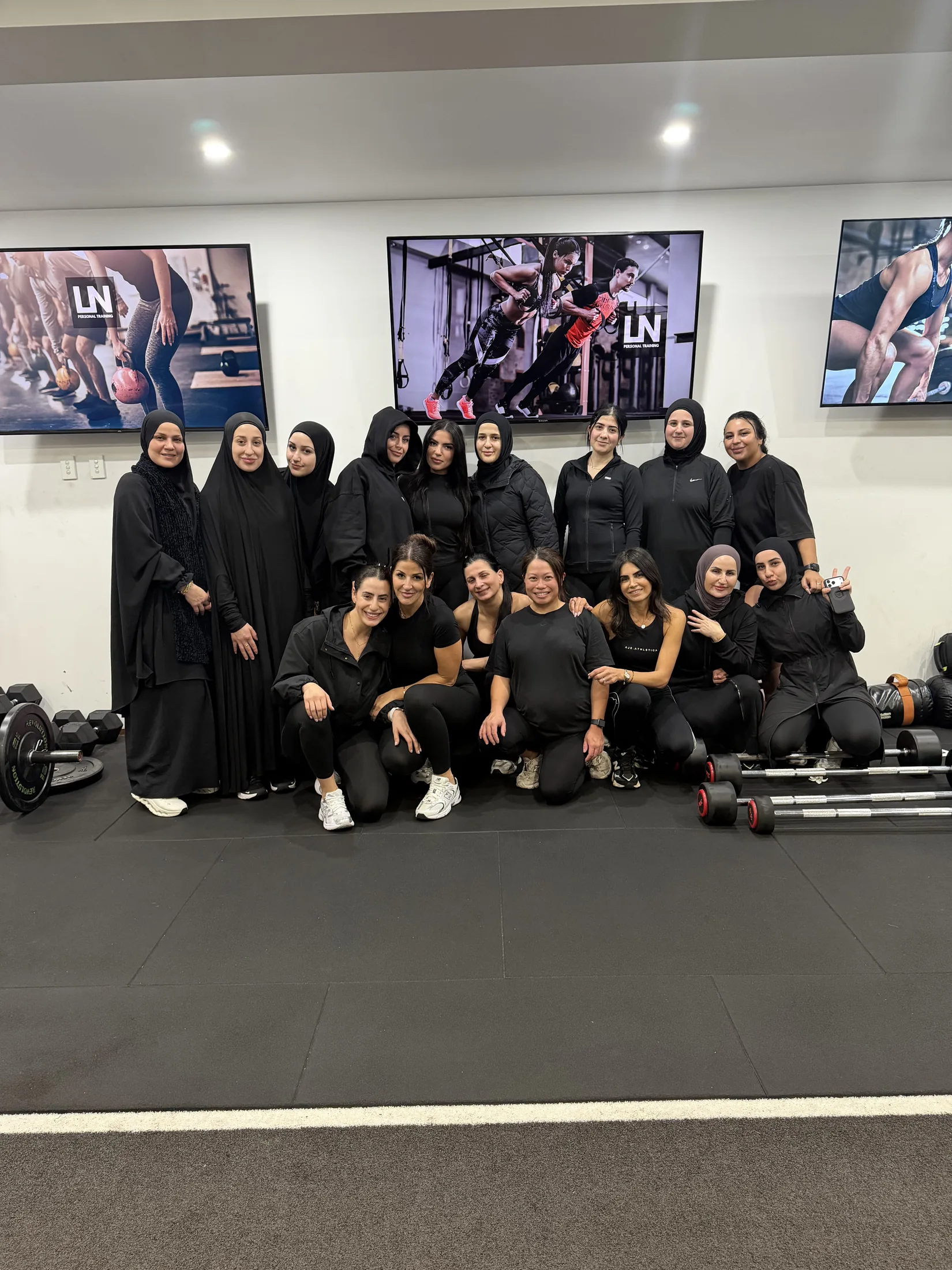 Women from the LNPT Ladies Only community gather for a group photo at the Condell Park studio.